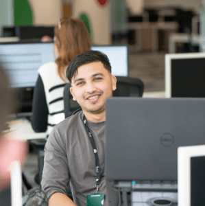 Recruitment Consultant in office smiling