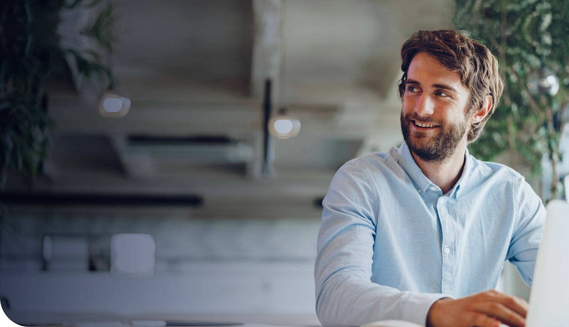 Recruitment Consultant working in office smiling