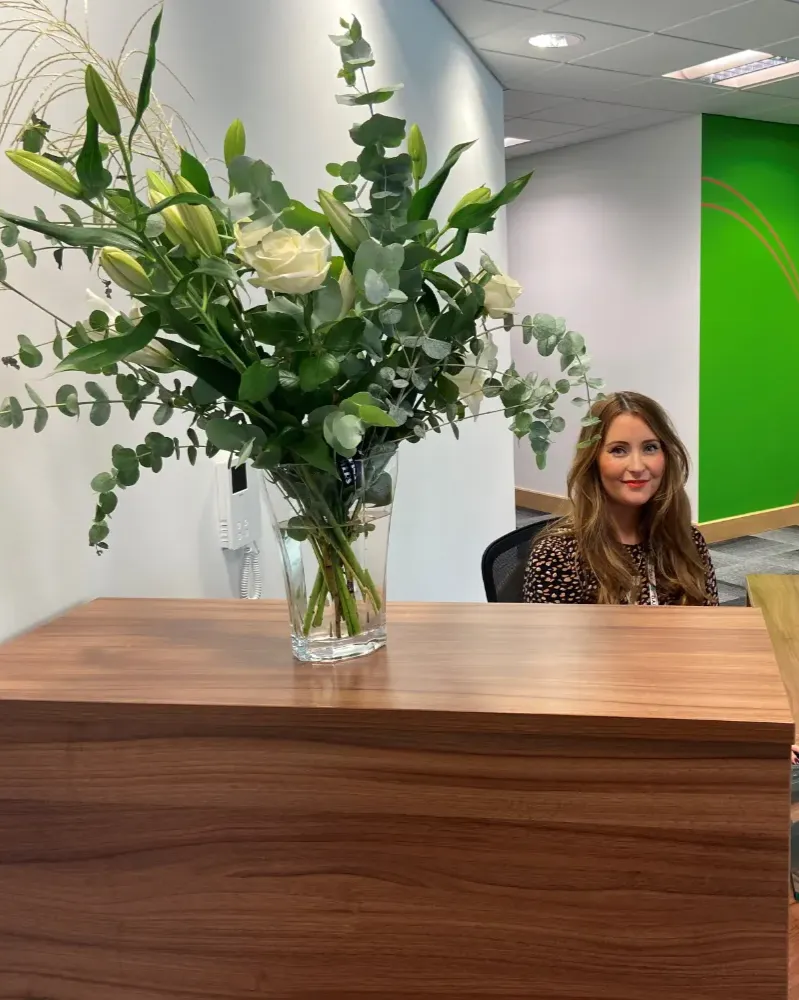 Receptionist at NRG Recruitment smiling